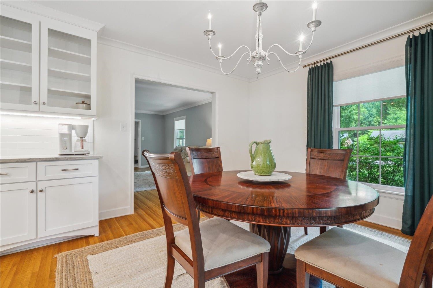 1141 Fair Meadow Road Memphis, TN 38117 - Photo 14 of 40 Dining room with light hardwood / wood-style floors, a chandelier, and ornamental molding