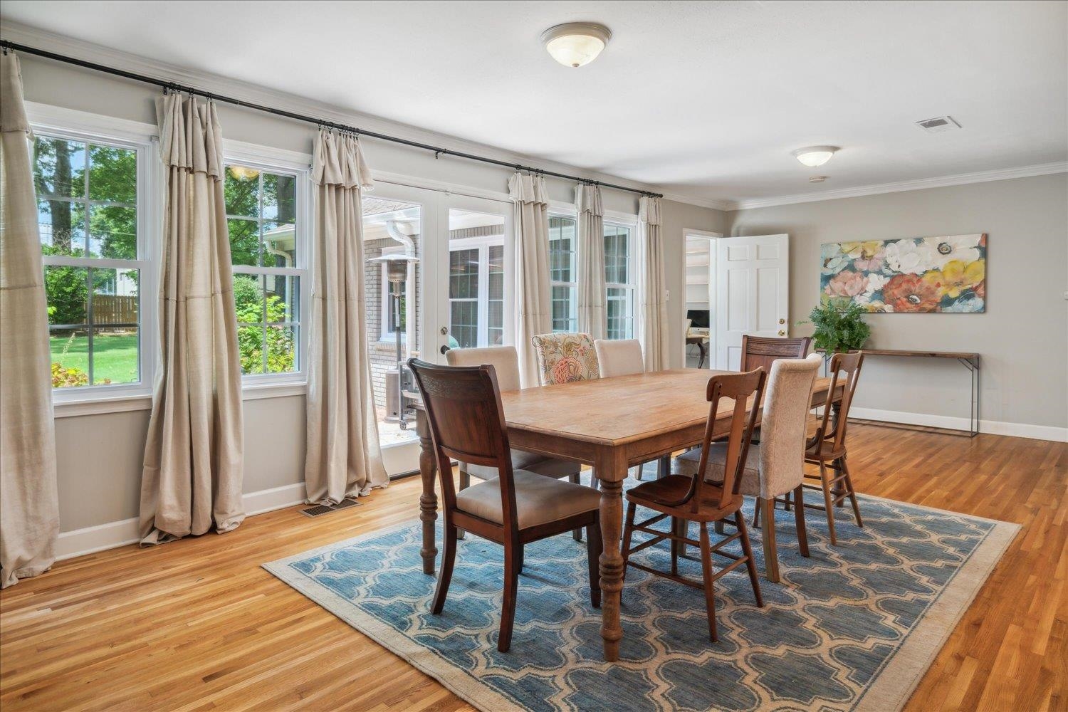 1141 Fair Meadow Road Memphis, TN 38117 - Photo 22 of 40 Dining space with ornamental molding, light hardwood / wood-style flooring, and a healthy amount of sunlight