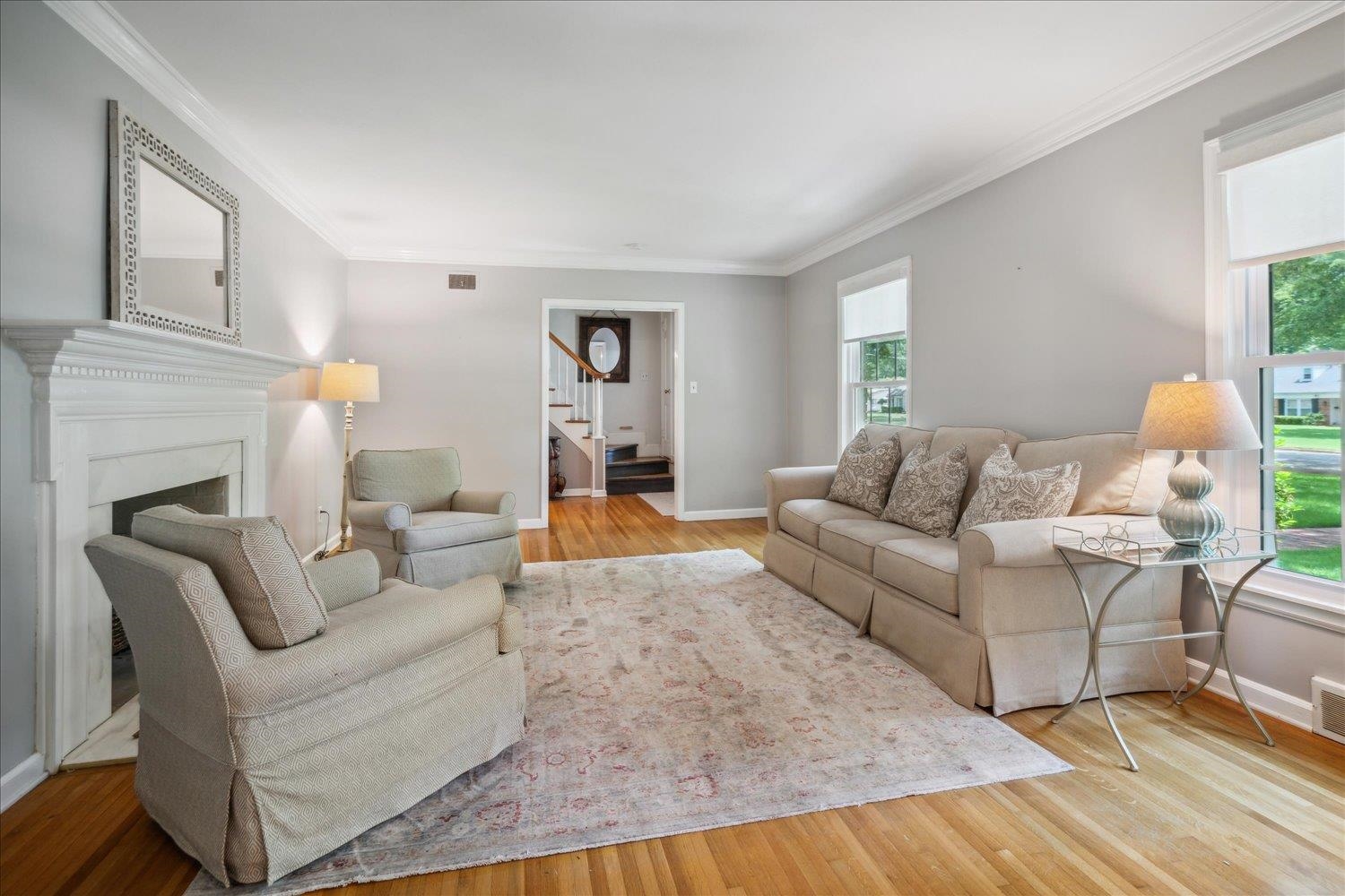 1141 Fair Meadow Road Memphis, TN 38117 - Photo 9 of 40 Living room featuring light hardwood / wood-style floors, crown molding, and a wealth of natural light