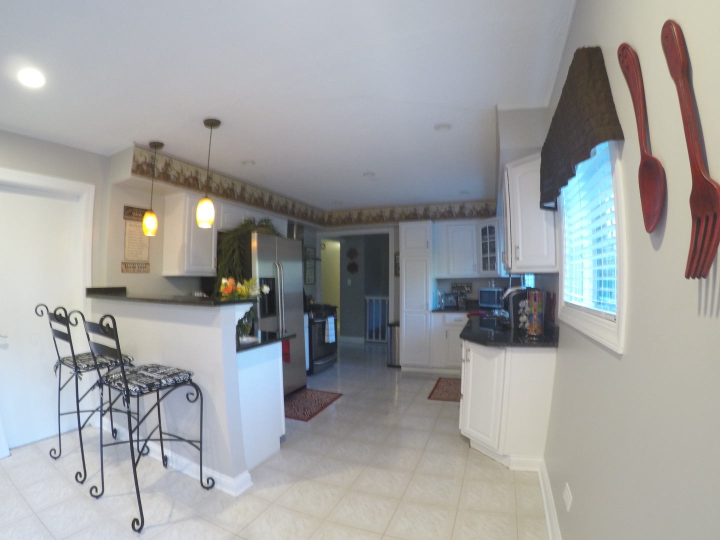 3N445 Rohlwing Road Addison, IL 60101 - Photo 2 of 19 a kitchen with stainless steel appliances kitchen island granite countertop a sink and cabinets
