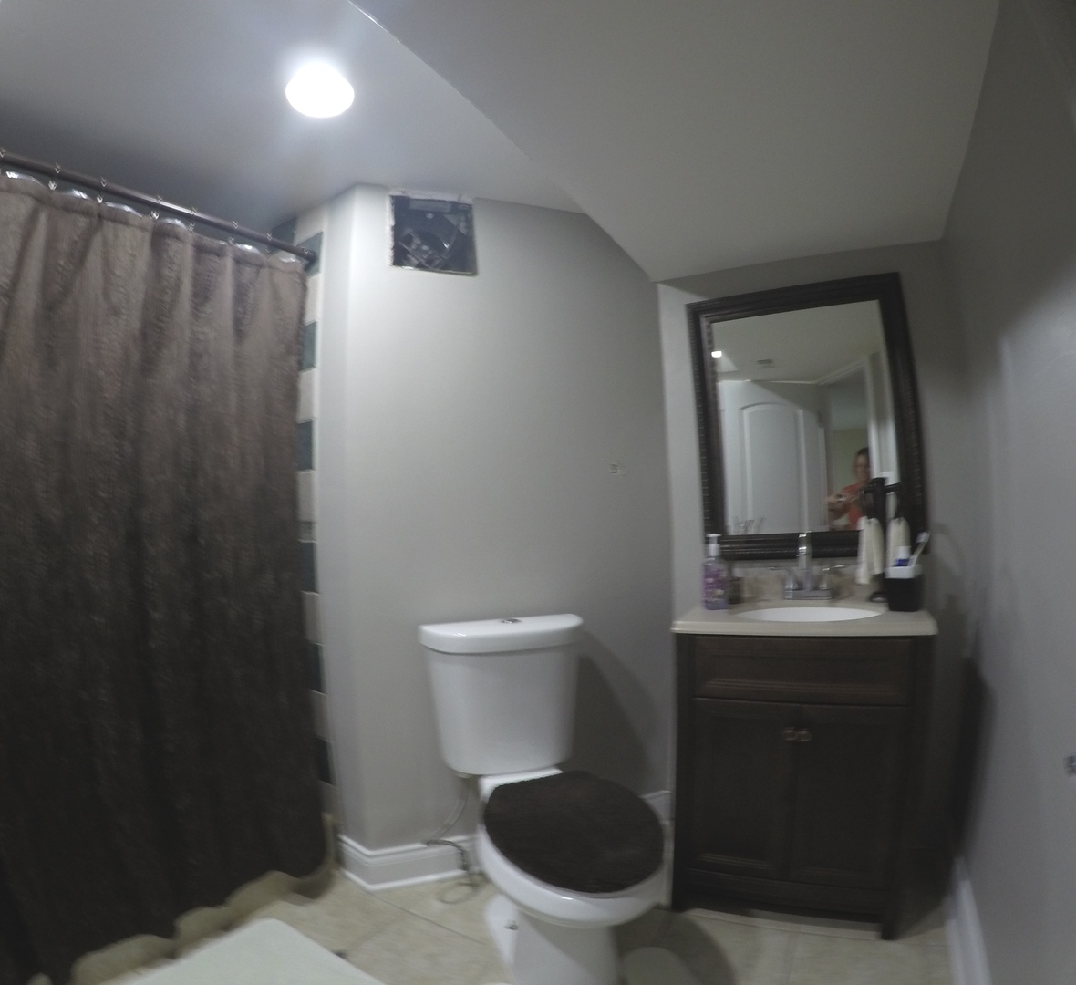 3N445 Rohlwing Road Addison, IL 60101 - Photo 12 of 19 a bathroom with a toilet a sink and mirror