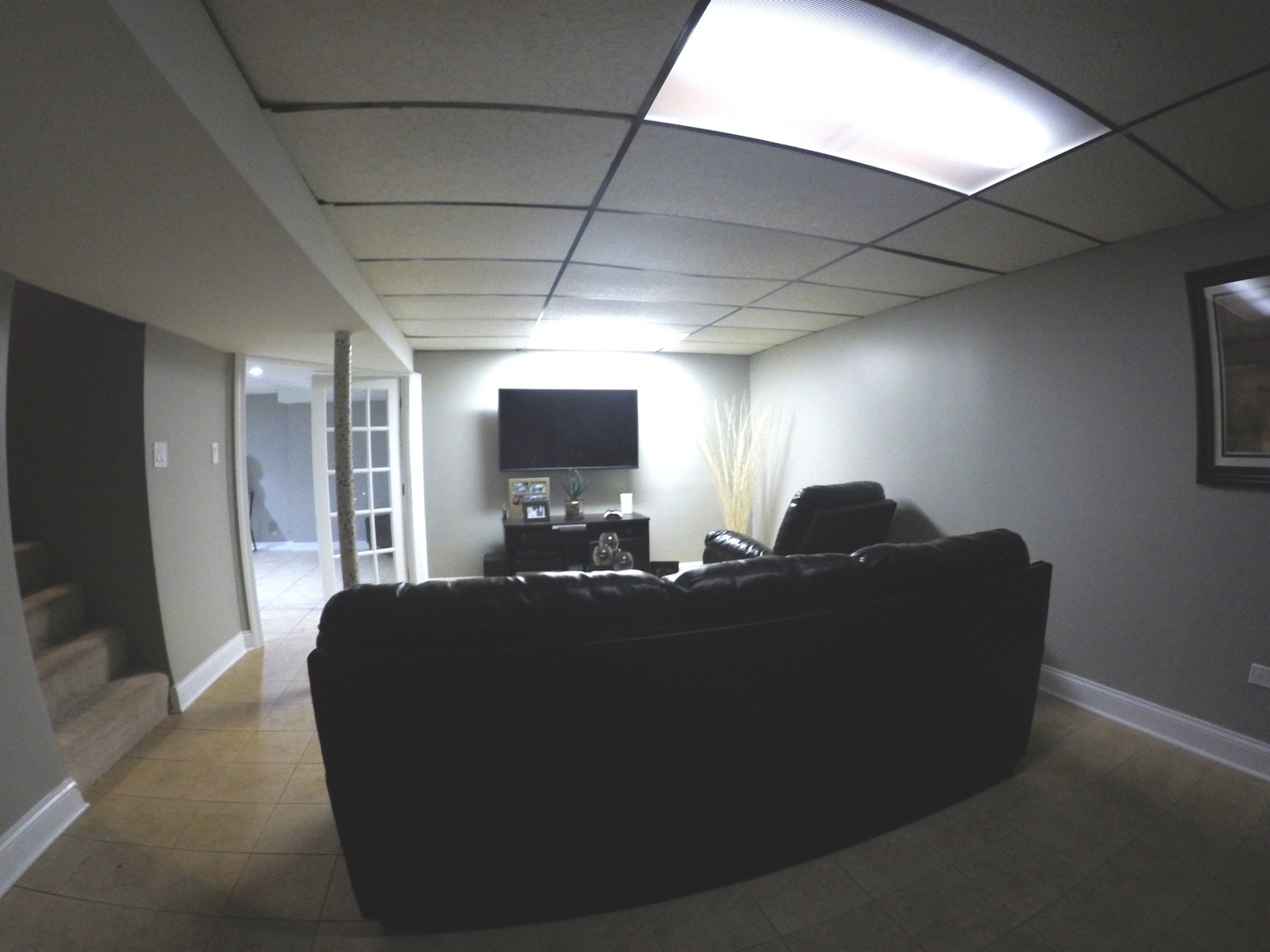 3N445 Rohlwing Road Addison, IL 60101 - Photo 14 of 19 a living room with furniture and a flat screen tv