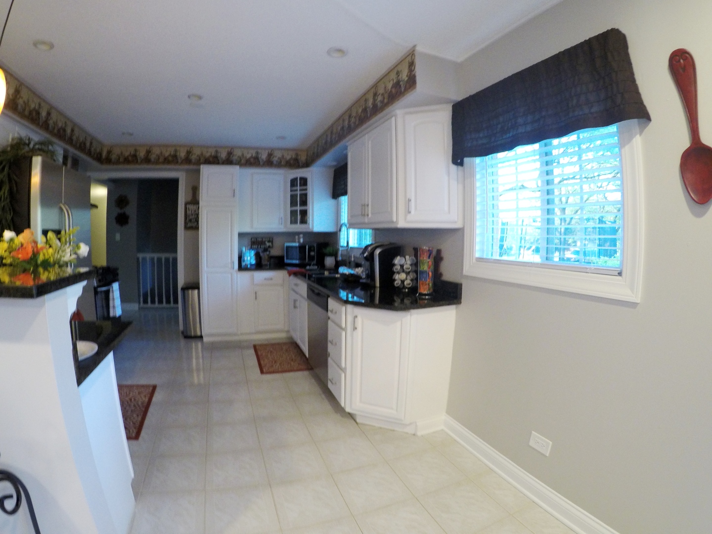 3N445 Rohlwing Road Addison, IL 60101 - Photo 3 of 19 a kitchen with a sink a window and appliances