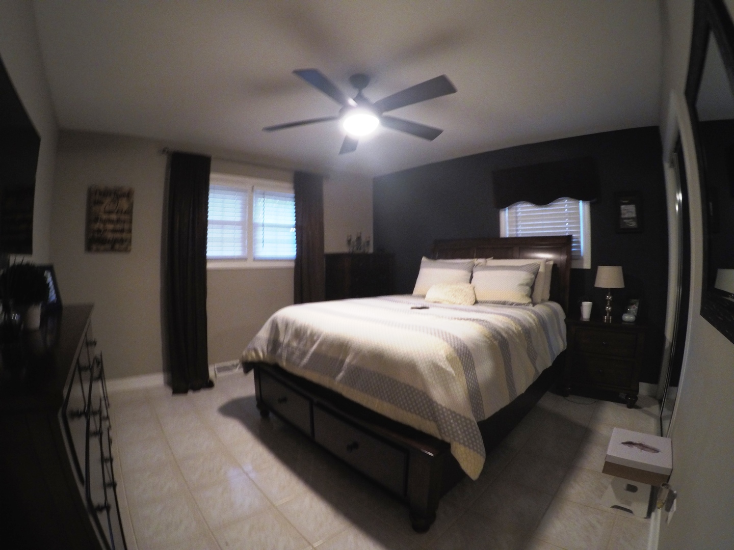 3N445 Rohlwing Road Addison, IL 60101 - Photo 8 of 19 a bedroom with a bed and a ceiling fan