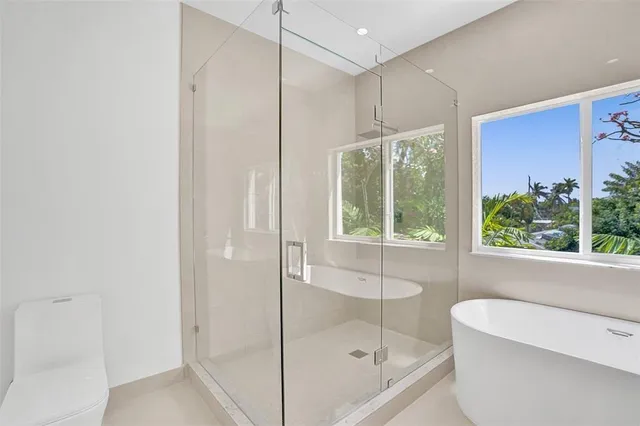 a bathroom with a shower and a bathtub
