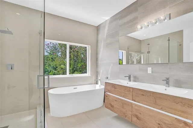 a bathroom with a bathtub and a sink
