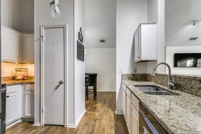 a kitchen with a sink stove and refrigerator