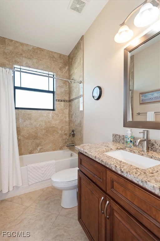 2011 Northwest 9th Place Cape Coral, FL 33993 - Photo 16 of 22 a bathroom with a granite countertop sink a toilet and a mirror