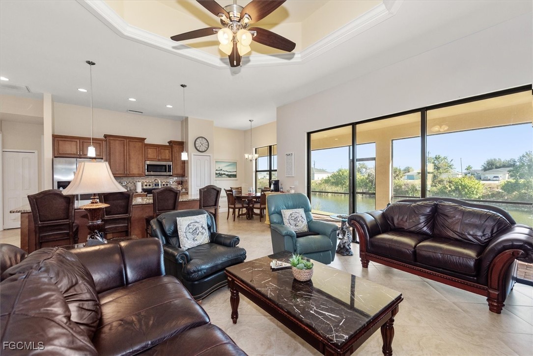 2011 Northwest 9th Place Cape Coral, FL 33993 - Photo 3 of 22 a living room with furniture and a large window