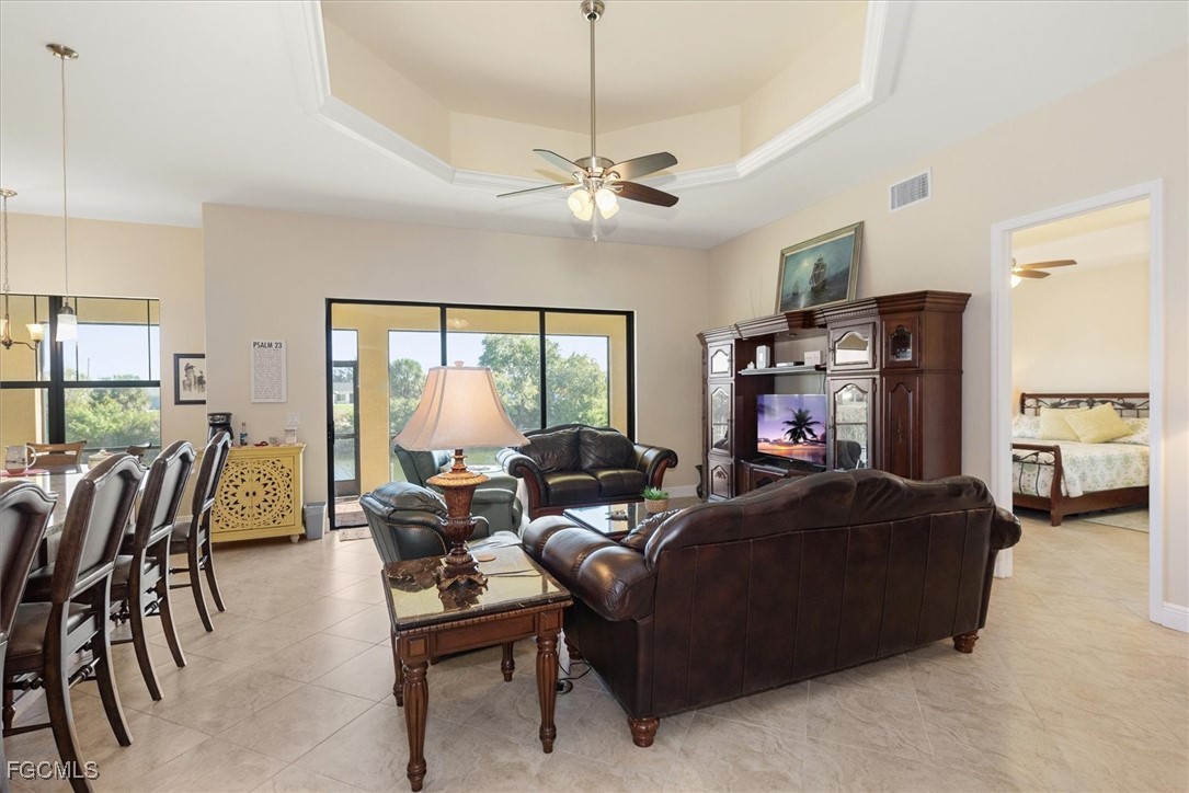 2011 Northwest 9th Place Cape Coral, FL 33993 - Photo 4 of 22 a living room with furniture and a large window