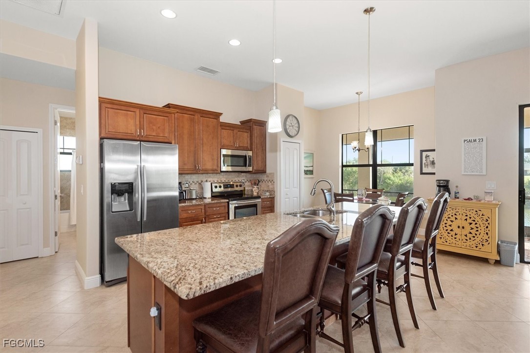 2011 Northwest 9th Place Cape Coral, FL 33993 - Photo 7 of 22 a view of a dining room with furniture