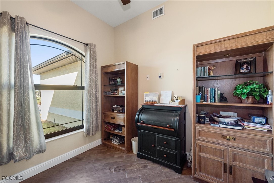 2011 Northwest 9th Place Cape Coral, FL 33993 - Photo 10 of 22 a kitchen with stainless steel appliances a stove and a refrigerator