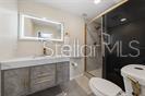 357 Ridgewood Street Altamonte Springs, FL 32701 - Photo 34 of 36 a bathroom with a sink a toilet a mirror and shower