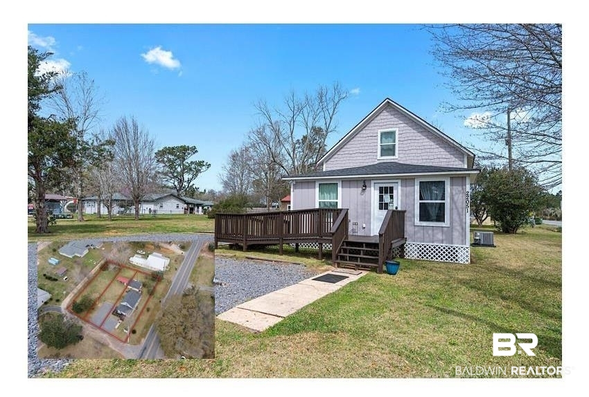 22051 Broad Street Silverhill, AL 36576 - Photo 1 of 28 Exterior space featuring central AC, a front yard, and a wooden deck