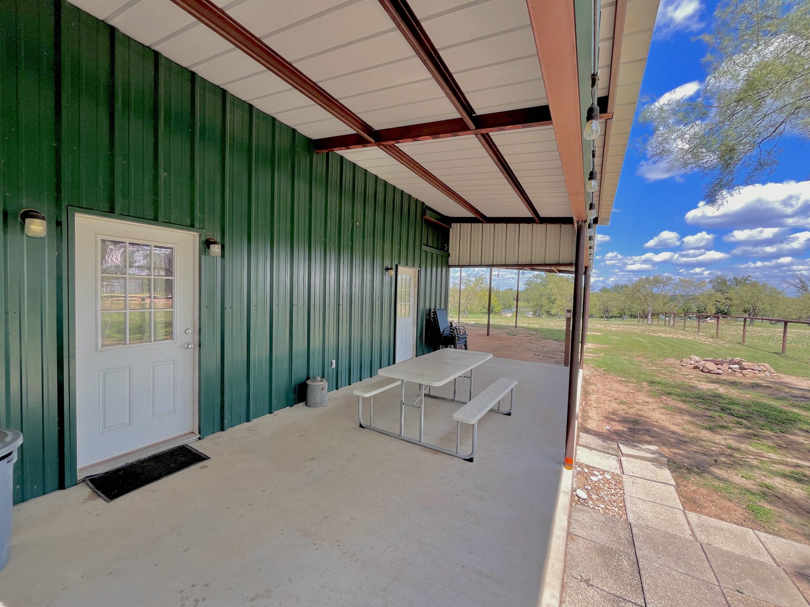 175 Elmer Road Llano, TX 78643 - Photo 14 of 25 a backyard of a house with table and chairs