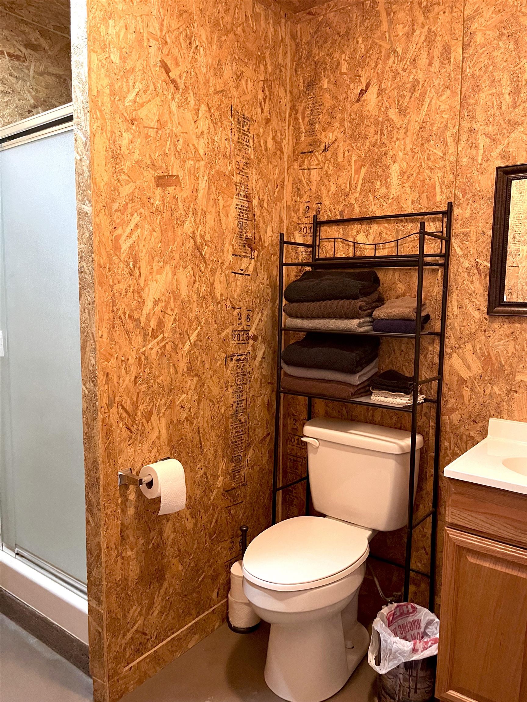 175 Elmer Road Llano, TX 78643 - Photo 21 of 25 a bathroom with a toilet and a sink