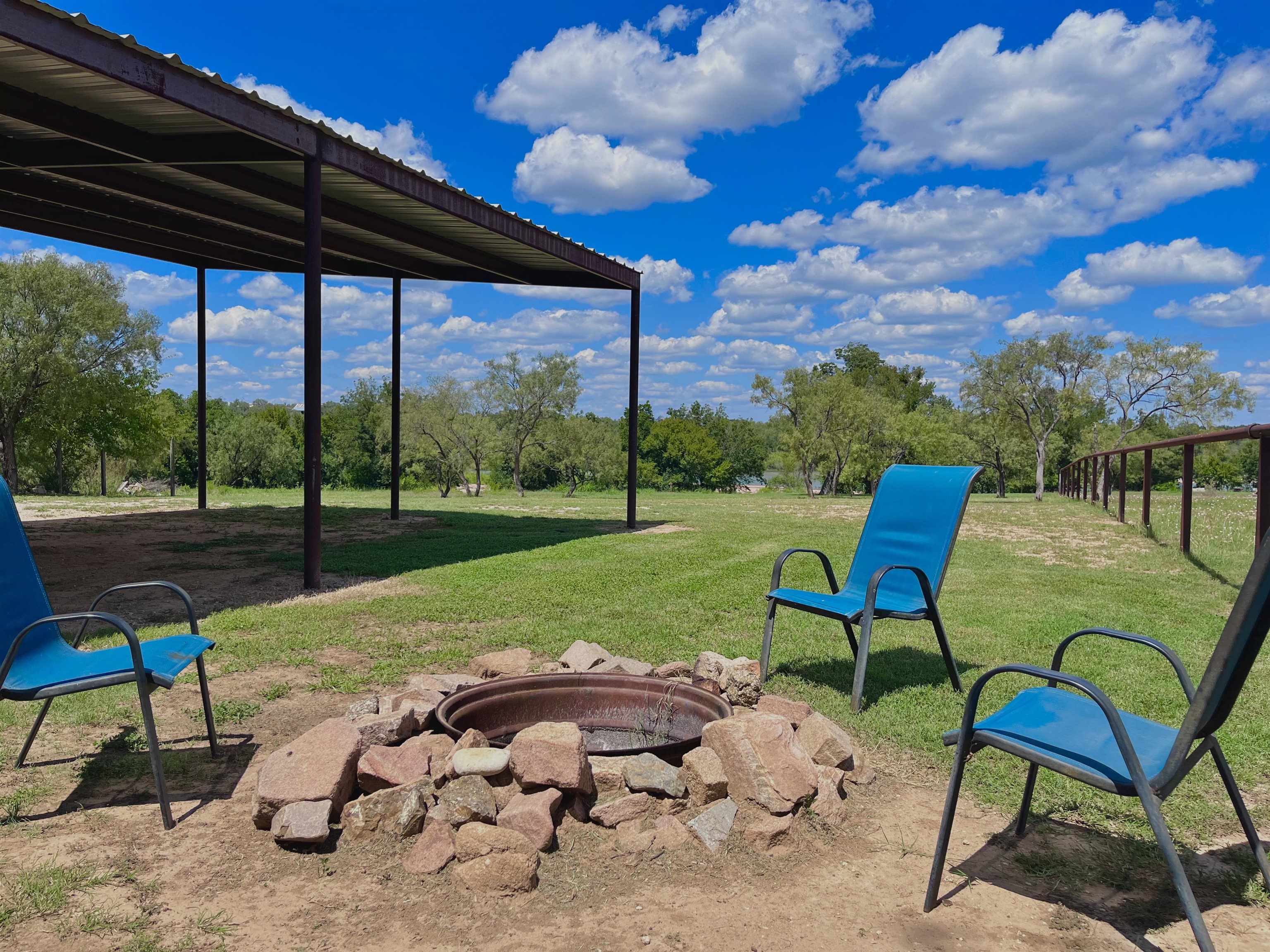 175 Elmer Road Llano, TX 78643 - Photo 22 of 25 a view of a backyard with sitting area