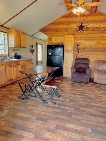 a bedroom with a bed and a night stand