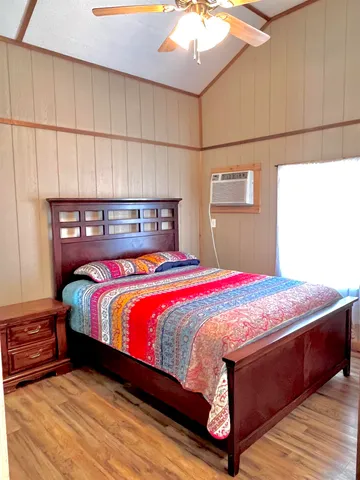 a bedroom with a bed and a mirror