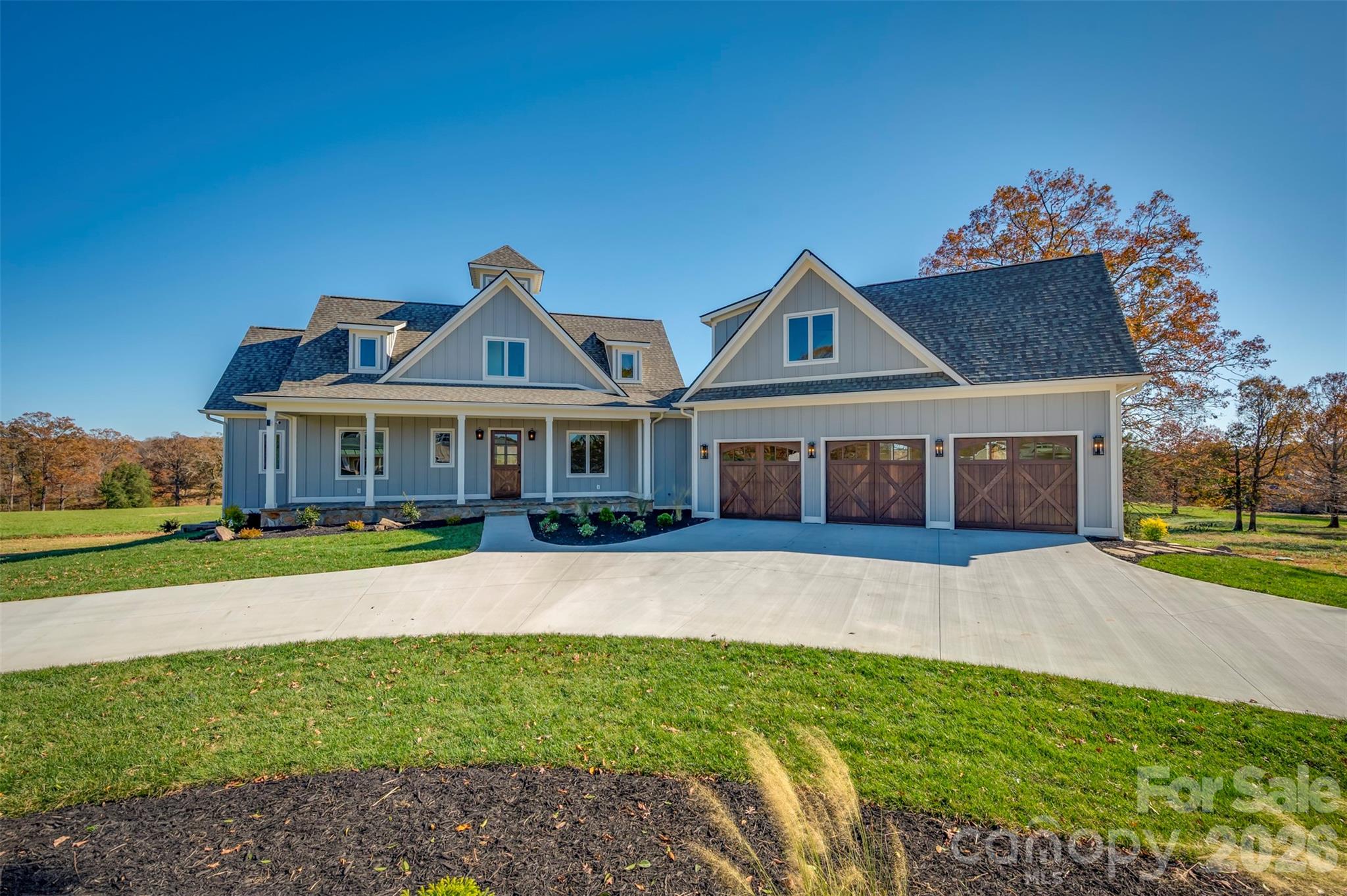 297 Mountain Meadows Lane, Unit 7 Tryon, NC 28782 - Photo 41 of 47 a front view of a house with a porch