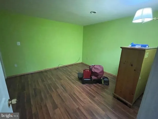 a room with cabinets and wooden floor