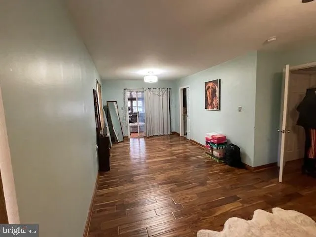 a view of a room with wooden floor and closet