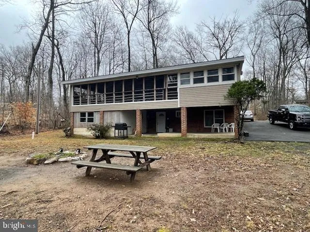 a house that has sitting area in front of it