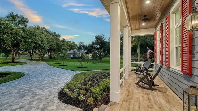 a kitchen with stainless steel appliances granite countertop a sink and a stove