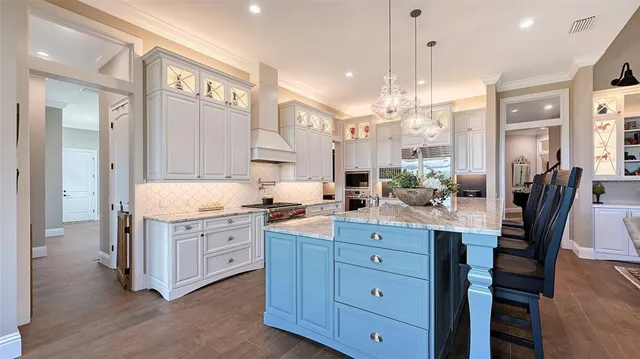 a bathroom with a granite countertop sink a toilet a mirror and shower