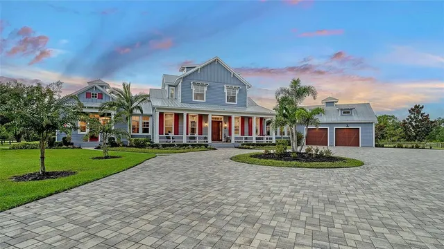 an aerial view of a house with outdoor space swimming pool and mountain view in back