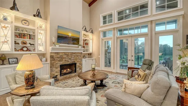 a view of backyard with table and chairs and a large tree