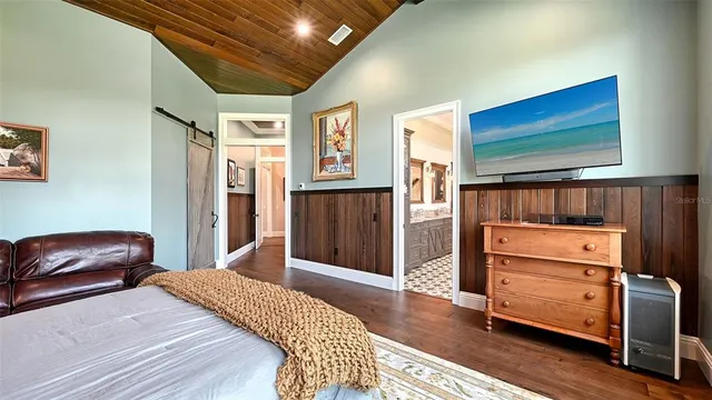 a view of a house with yard and tree s