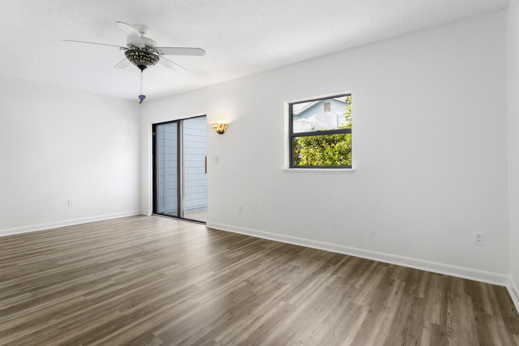 6075 Wolfe Street Jupiter, FL 33458 - Photo 15 of 27 wooden floor in an empty room with a window