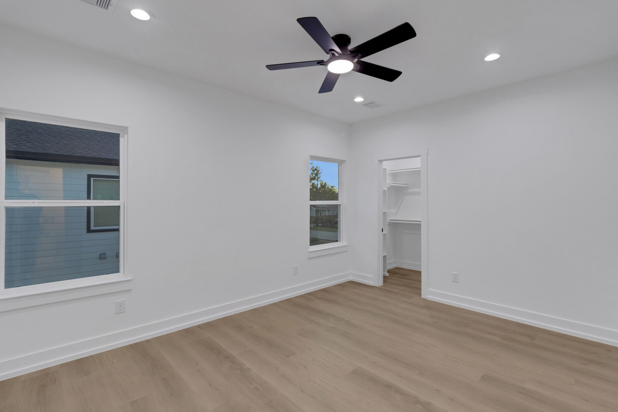 4202 Plaag Street Houston, TX 77016 - Photo 32 of 38 Spacious secondary bedroom with recessed lighting, ceiling fan, and direct access to a walk-in closet.