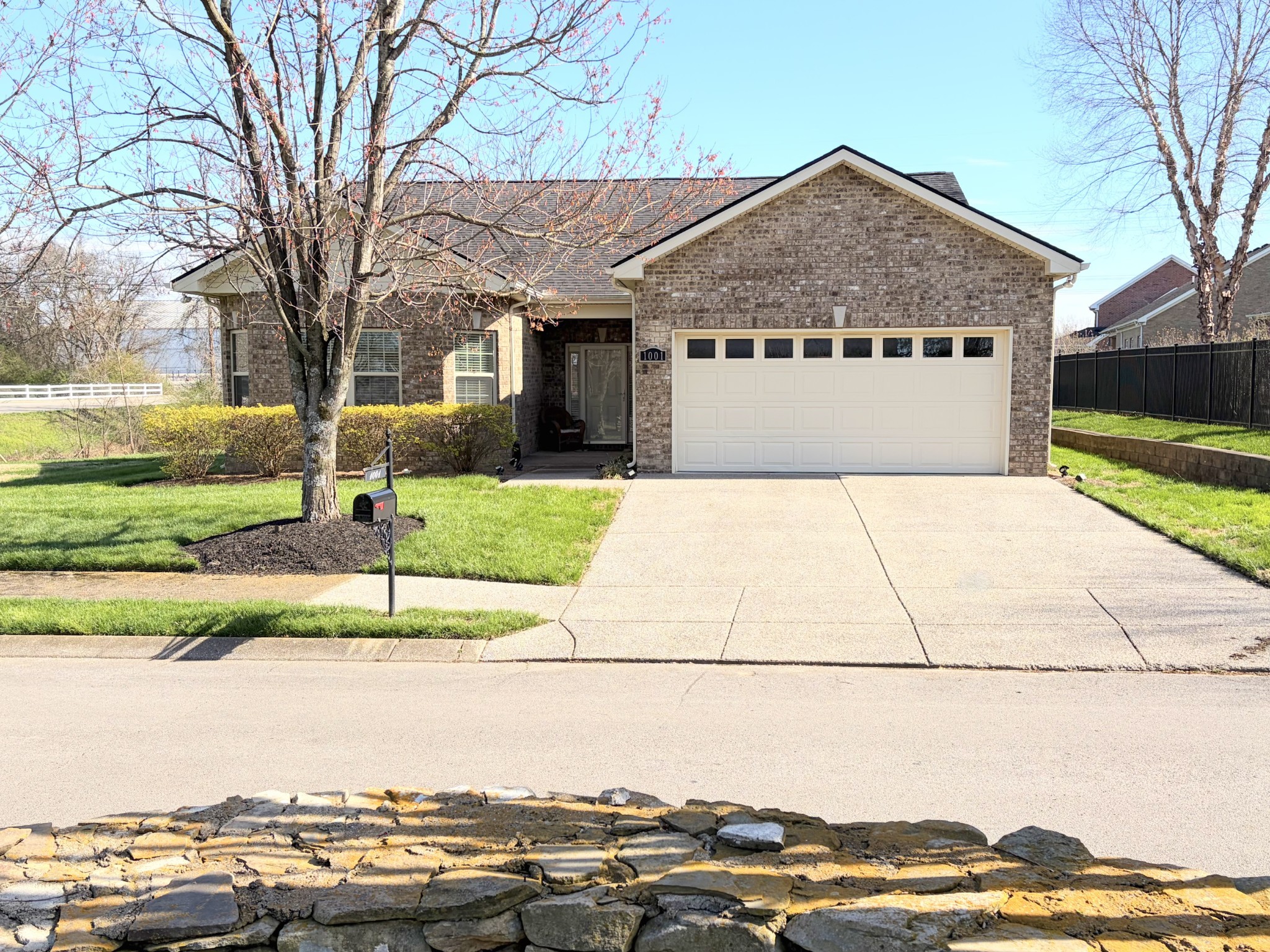 1001 Meadow View Drive Spring Hill, TN 37174 - Photo 1 of 34 a front view of a house with a yard and garage