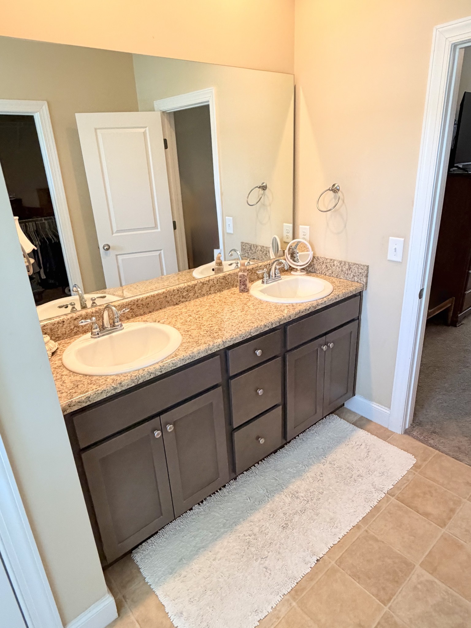 1001 Meadow View Drive Spring Hill, TN 37174 - Photo 20 of 34 a bathroom with a sink vanity granite and a mirror