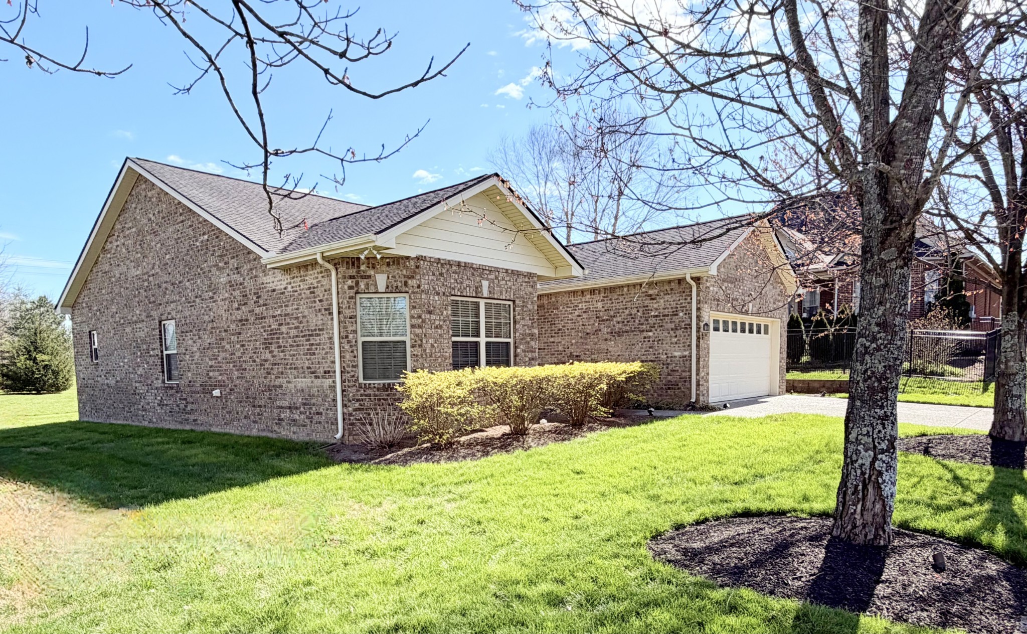 1001 Meadow View Drive Spring Hill, TN 37174 - Photo 2 of 34 a view of a house with yard and a garden