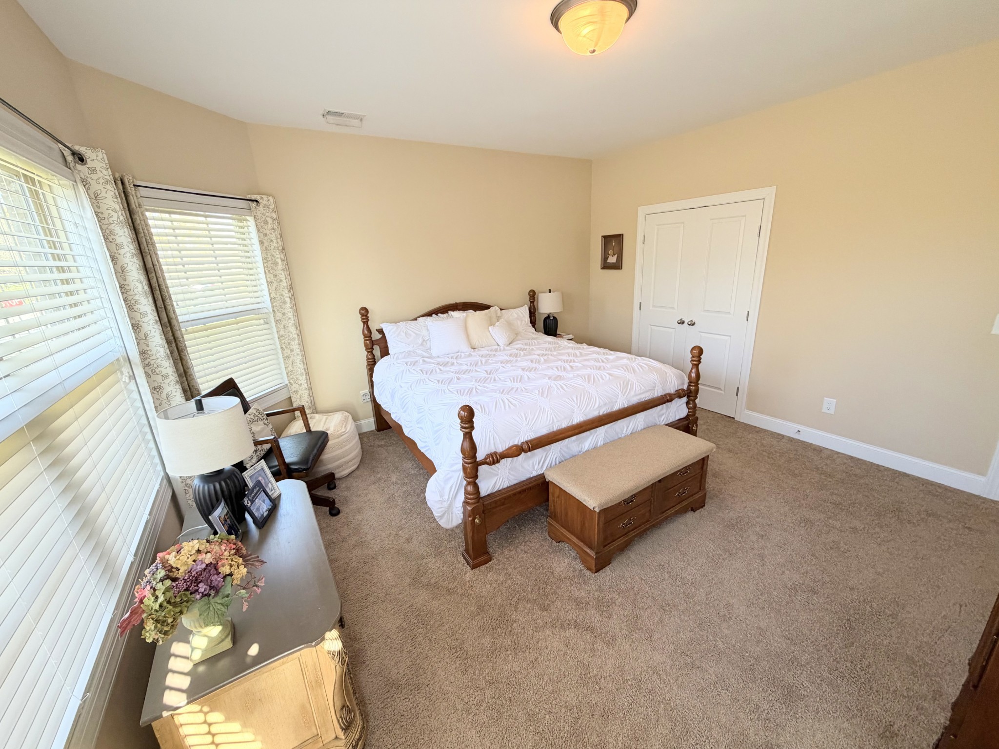 1001 Meadow View Drive Spring Hill, TN 37174 - Photo 25 of 34 a bedroom with a bed and a chandelier