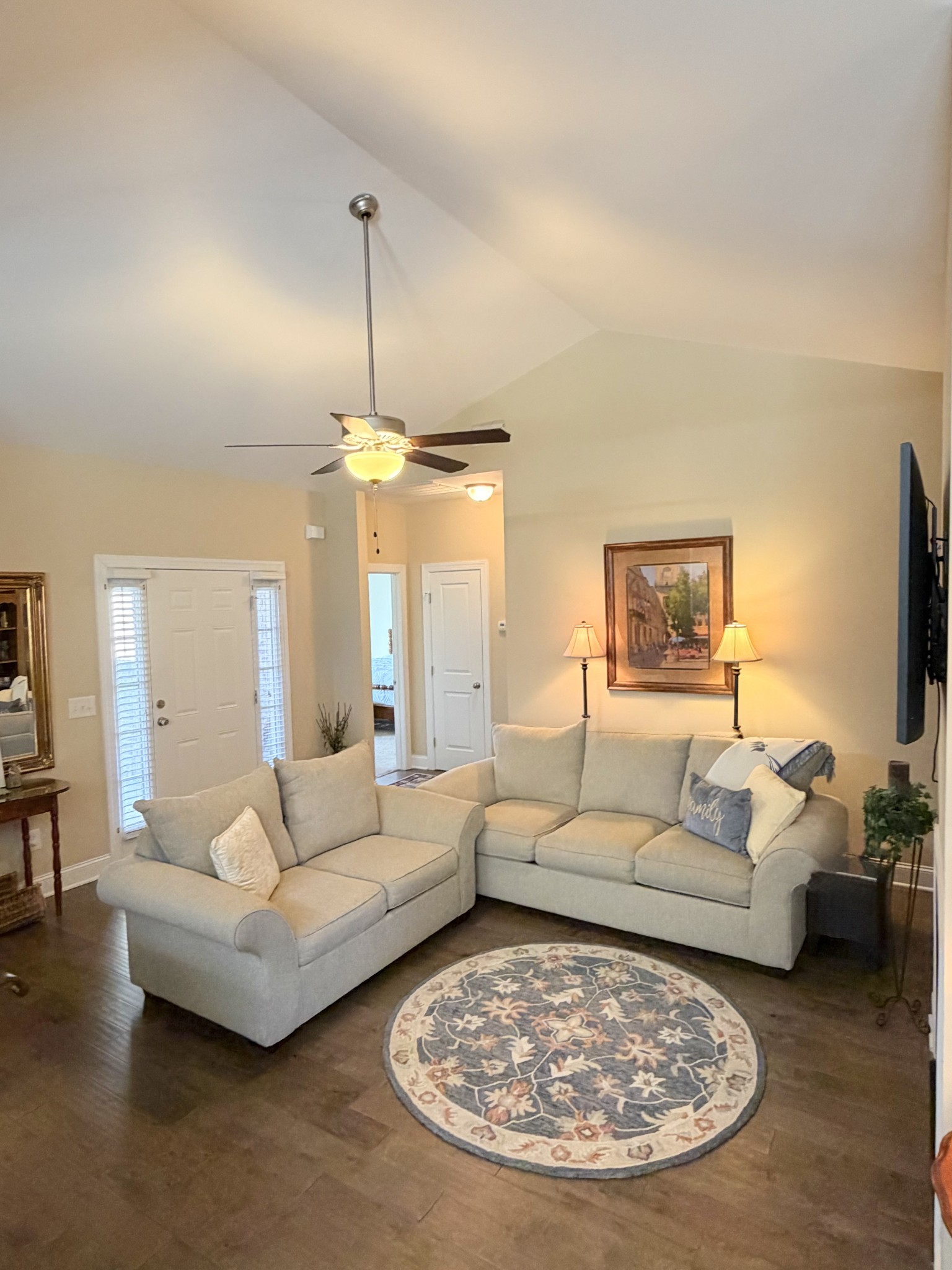 1001 Meadow View Drive Spring Hill, TN 37174 - Photo 8 of 34 a living room with furniture a rug and a chandelier