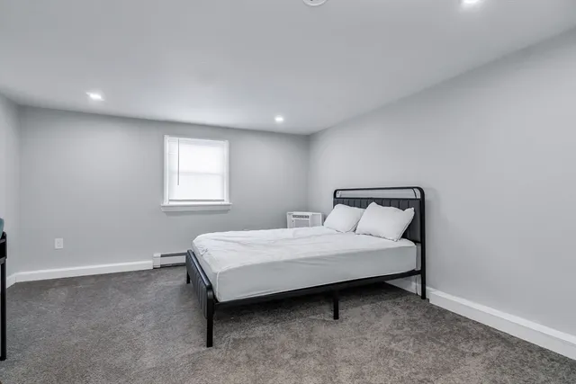 a room with a bed and a window