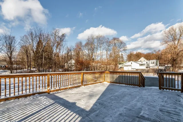 a view of a balcony with wooden fence