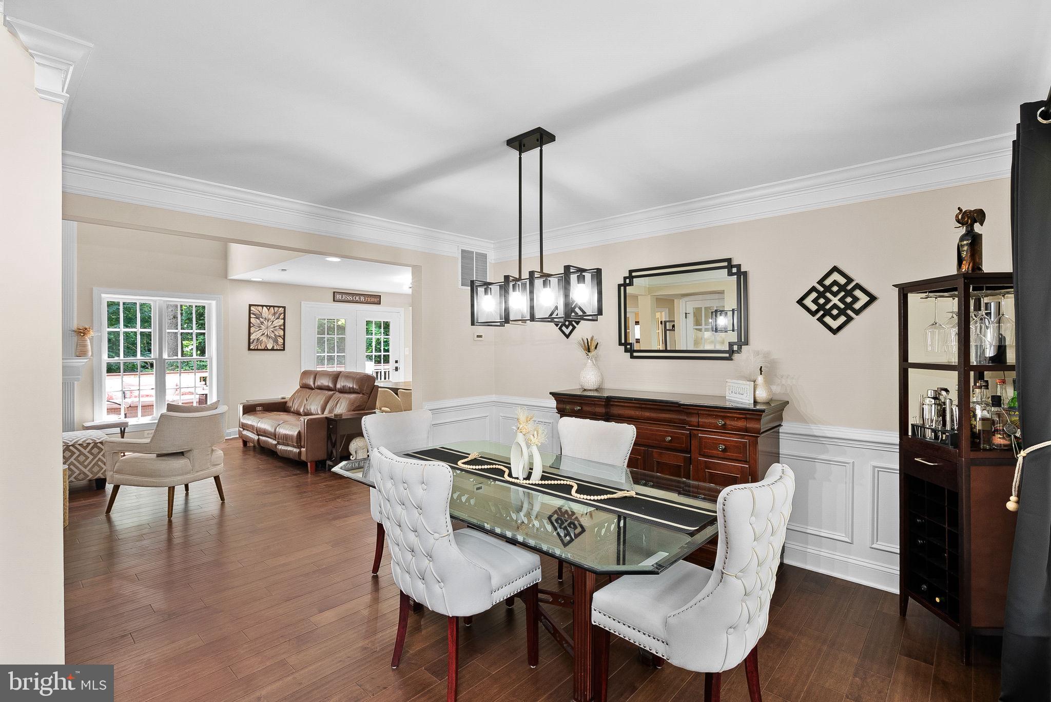 7214 Calamo Street Springfield, VA 22150 - Photo 14 of 77 Dining room with chandelier