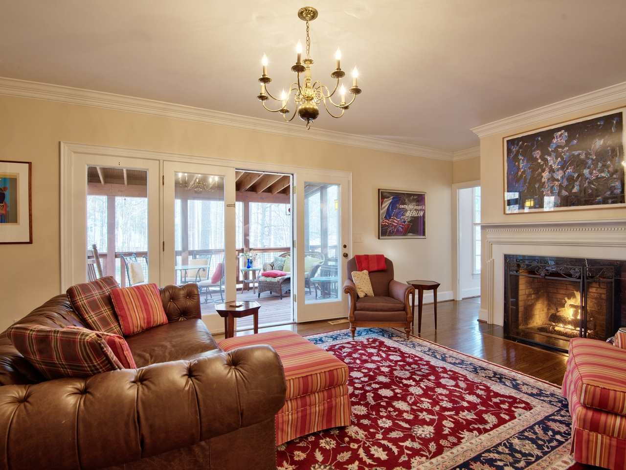 3809 Chippenham Road Durham, NC 27707 - Photo 11 of 23 Cozy inviting space with gas log fireplace, bookcases and door onto screen porch. Den/Family/Great Room