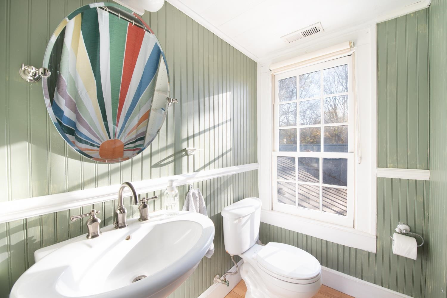 2417 Hodges Road Burlington, NC 27217 - Photo 18 of 30 a bathroom with a sink a toilet and a mirror