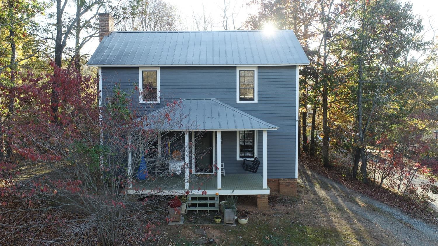 2417 Hodges Road Burlington, NC 27217 - Photo 29 of 30 a front view of a house with a garden and porch
