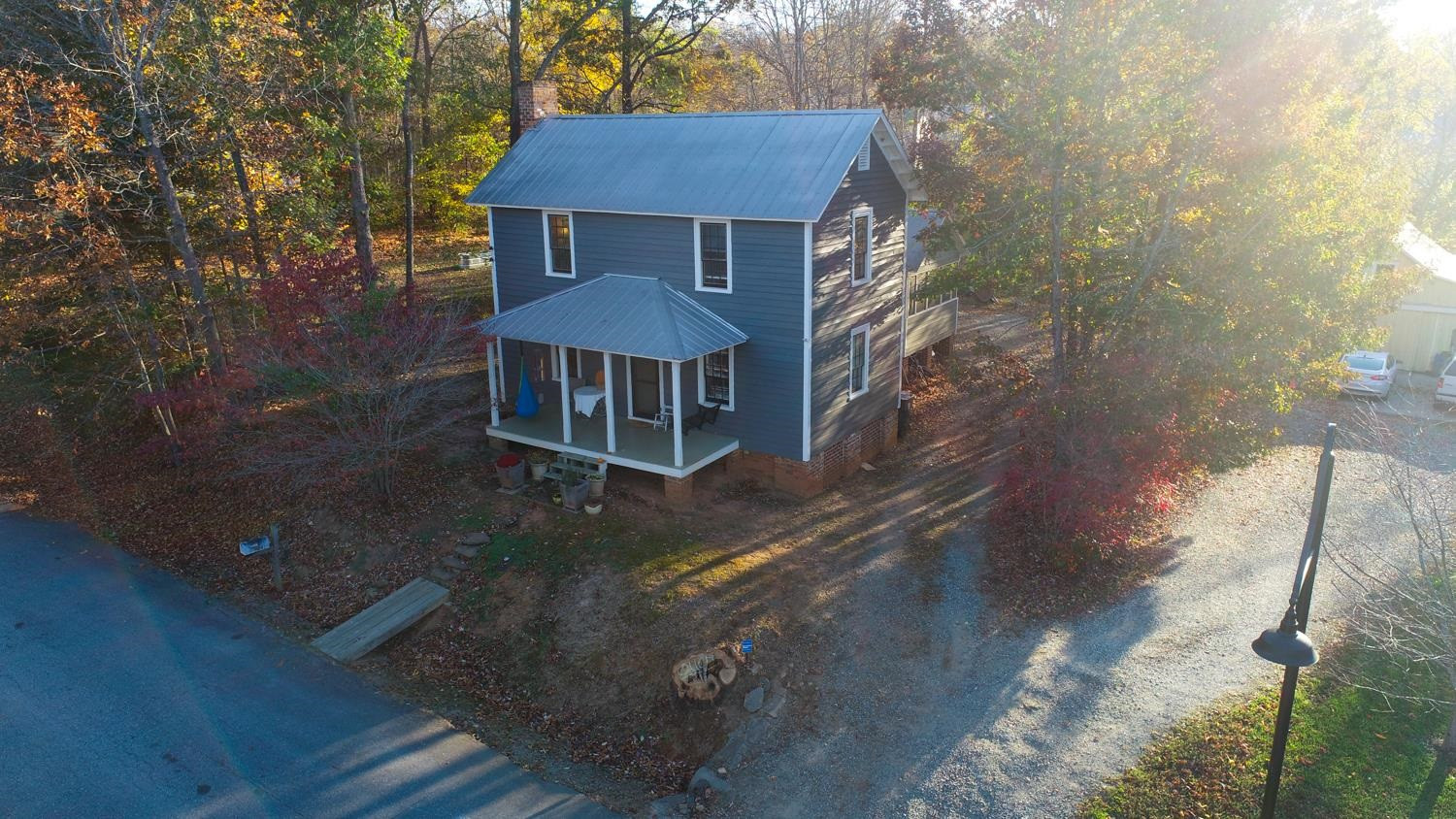 2417 Hodges Road Burlington, NC 27217 - Photo 3 of 30 a front view of a house with yard and trees in the background
