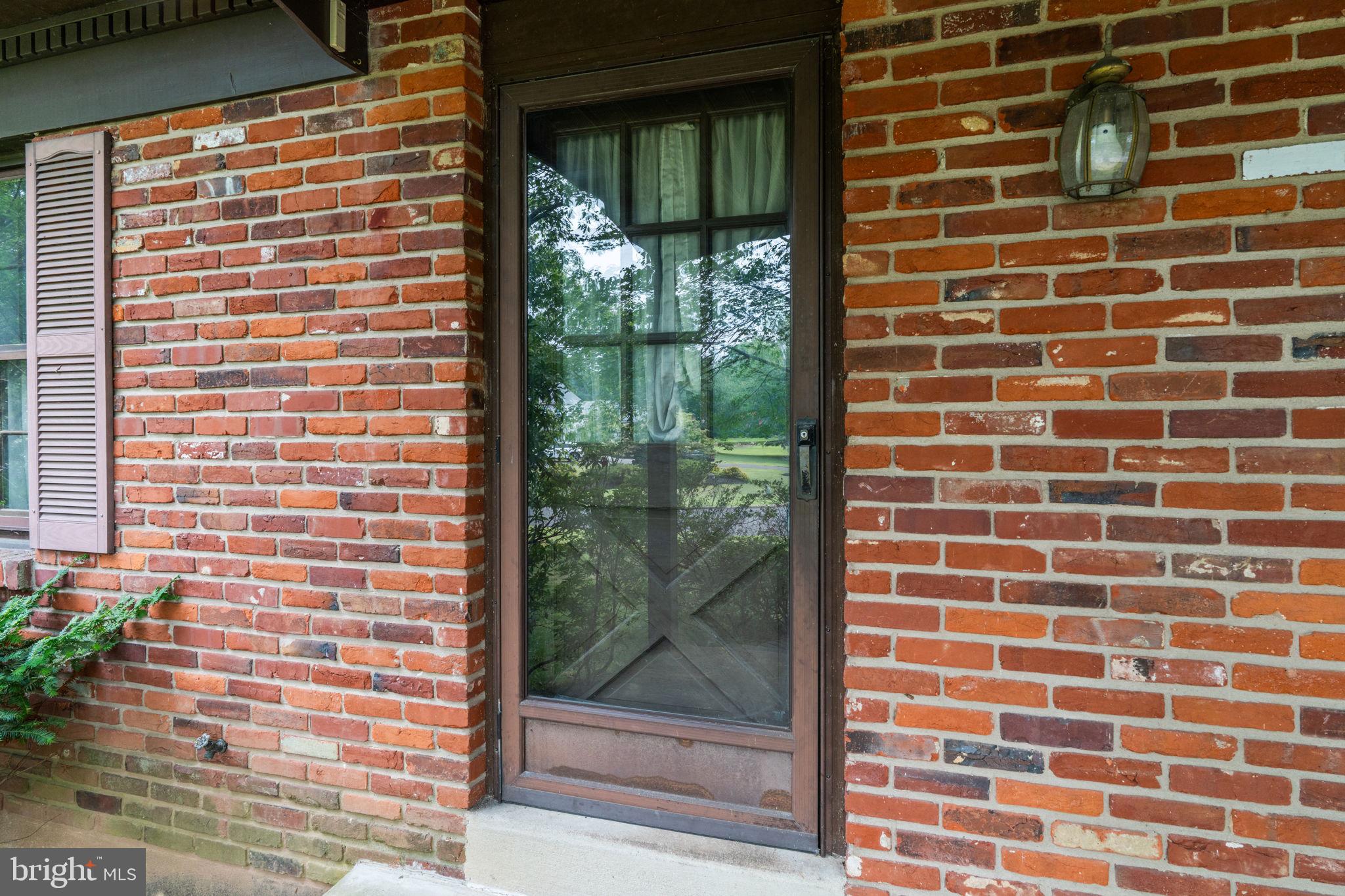 67 Harvest Road Warminster, PA 18974 - Photo 3 of 38 a view of a brick building from a window