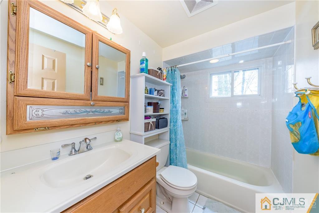 1 Westminster Road Colonia, NJ 07067 - Photo 23 of 25 a bathroom with a sink a toilet and bathtub