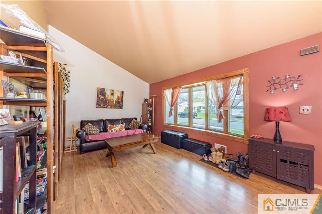 1 Westminster Road Colonia, NJ 07067 - Photo 4 of 25 a living room with furniture and a wooden floor