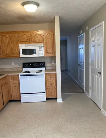 a kitchen with a stove and a microwave